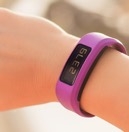 Pink smart watch on persons arm